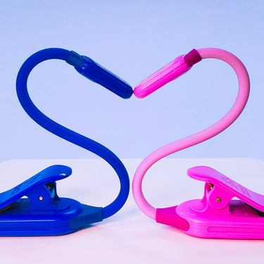 The Midnight Blue and Lavender WonderFlex Rechargeable lights bent into the shape of a heart.