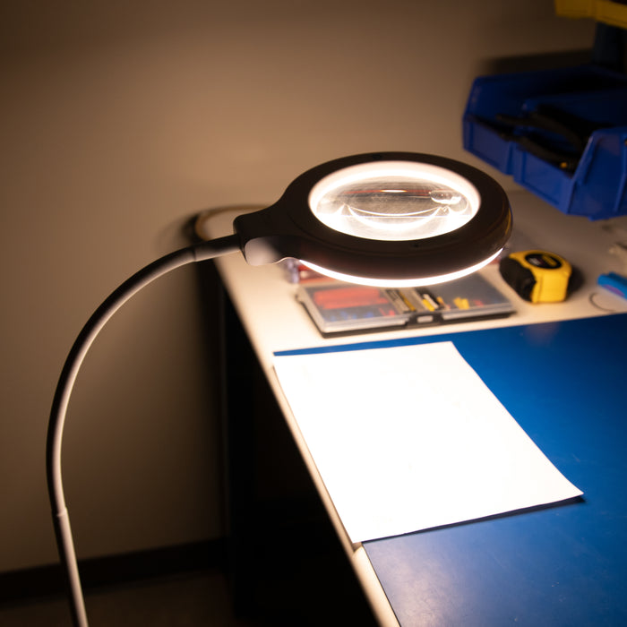 The rechargeable Magnifier Lamp in use at a worktable.