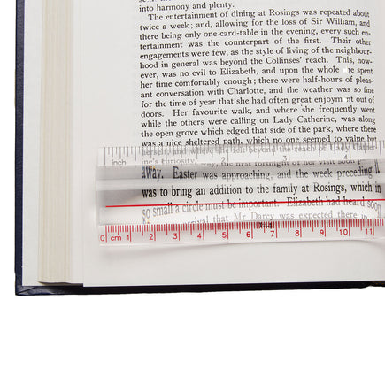 Ruler Magnifier by Mighty Bright - in use image of the magnifier being used with a book